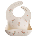 mushie Silicone Baby Bib | Adjustable Fit Waterproof Bibs (Pink Flowers)