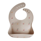mushie Silicone Baby Bib | Adjustable Fit Waterproof Bibs (Cherries)