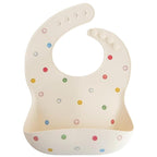 mushie Silicone Baby Bib | Adjustable Fit Waterproof Bibs (Smiley Face)