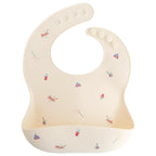 mushie Silicone Baby Bib | Adjustable Fit Waterproof Bibs (Circus)