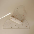 mushie Silicone Baby Bib | Adjustable Fit Waterproof Bibs (Kites)