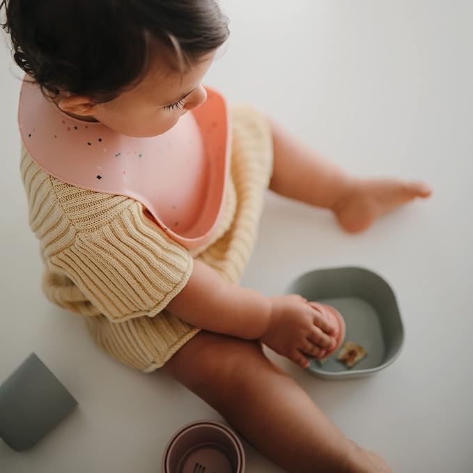 mushie Silicone Baby Bib | Adjustable Fit Waterproof Bibs (Powder Pink Confetti)