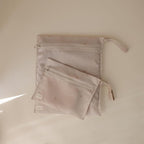 mushie Water Resistant Wet Bags | Large & Small Reusable Storage Bag for Baby Items and Travel | Zippered Pockets with Handle | Machine Washable, Set of 2 (Sun)