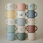 mushie Silicone Snack Cup | Spill Proof Food Container for Toddler and Baby (Lilac Flowers)