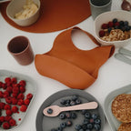 mushie Silicone Baby Bib | Adjustable Fit Waterproof Bibs (Clay)