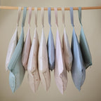 mushie Water Resistant Wet Bags | Large & Small Reusable Storage Bag for Baby Items and Travel | Zippered Pockets with Handle | Machine Washable, Set of 2 (Roman Green)