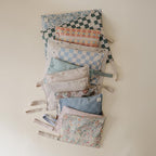 mushie Water Resistant Wet Bags | Large & Small Reusable Storage Bag for Baby Items and Travel | Zippered Pockets with Handle | Machine Washable, Set of 2 (Pastel Blooms)