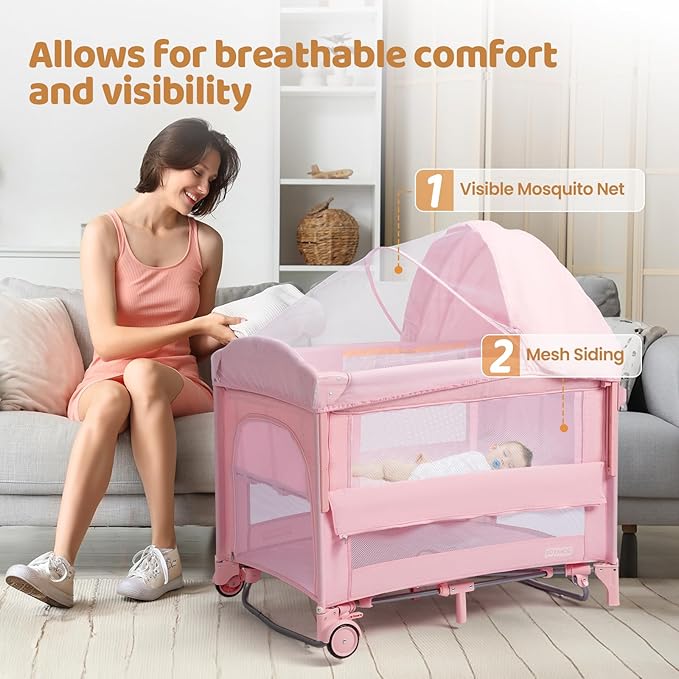 JOYMOR 9 in 1 Bedside Bassinet with Changing Table, Pack and Play with Bassinet, Convert to Rocking Baby Bed with Electric Music Center, Mosquito Net, Storage,Pink