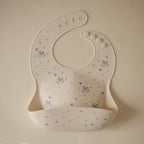 mushie x Bluey Silicone Baby Bib | Adjustable Fit Waterproof Bibs (Bluey Ivory)