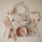 mushie Silicone Baby Bib | Adjustable Fit Waterproof Bibs (Lilac Flowers)