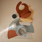 mushie Silicone Baby Bib | Adjustable Fit Waterproof Bibs (Clay)