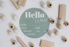 Hickory Hollow Designs - Baby Announcement Sign for Newborn Boys and Girls (Color Bases) - Hello World Nursery Decor Sign & Photo Prop for Babies Made of Birch Wood - 6" Circle Board (Sage)