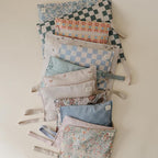 mushie Water Resistant Wet Bags | Large & Small Reusable Storage Bag for Baby Items and Travel | Zippered Pockets with Handle | Machine Washable, Set of 2 (Retro Flowers)