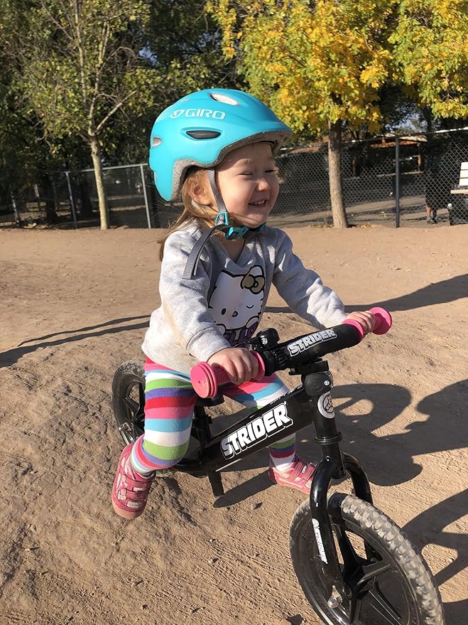 Strider 12” Sport Bike - No Pedal Balance Bicycle for Kids 1 to 4 Years - Includes Safety Pad, Padded Seat, Mini Grips & Flat-Free Tires - Tool-Free Assembly & Adjustments